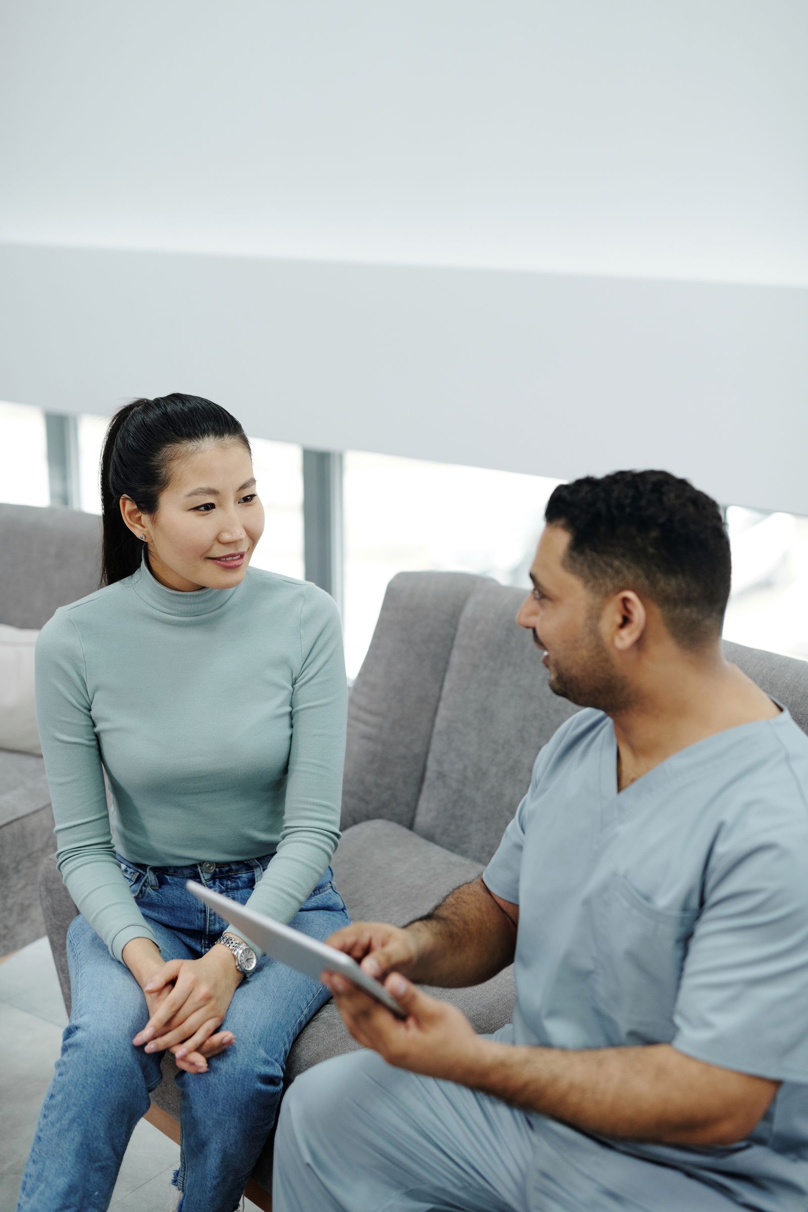 A healthcare professional talking with a patient